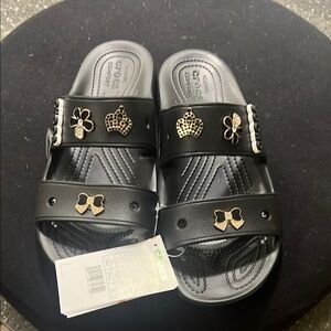 Crocs Kids Black Sandals with Gold Accents